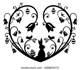 Paper cut heart with Easter bunny, eggs snowdrops and daffodils.