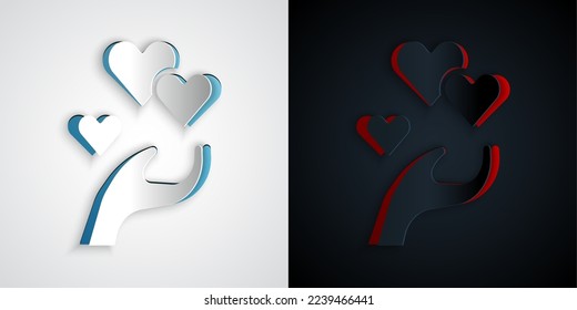 Paper cut Heart in hand icon isolated on grey and black background. Hand giving love symbol. Valentines day symbol. Paper art style. Vector