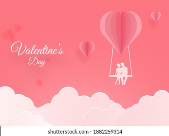 Paper Cut Heart Swing With Silhouette Couple And Clouds On Light Red Background For Valentine's Day Concept.