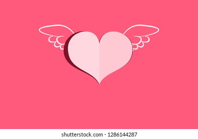paper cut heart with wings on red pink background