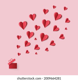Paper cut hearts flying out from gift box.  Greeting card with love symbol for Mother's, Valentine's Day, birthday .