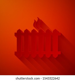 Paper cut Heating radiator icon isolated on red background. Paper art style. Vector Illustration
