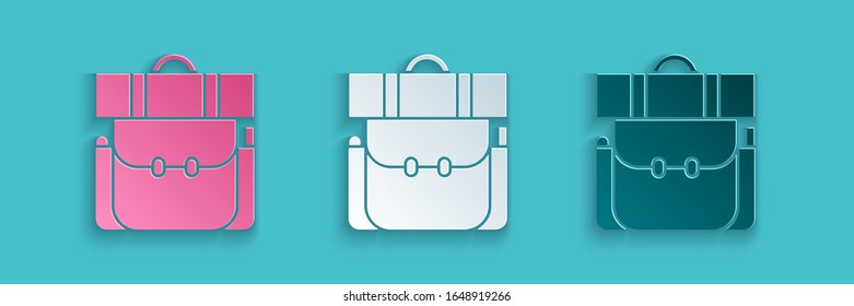 Paper cut Hiking backpack icon isolated on blue background. Camping and mountain exploring backpack. Paper art style. Vector Illustration