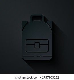 Paper cut Hiking backpack icon isolated on black background. Camping and mountain exploring backpack. Paper art style. Vector Illustration