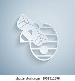 Paper cut Hive for bees icon isolated on grey background. Beehive symbol. Apiary and beekeeping. Sweet natural food. Paper art style. Vector
