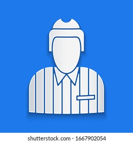 Paper cut Hockey judge, referee, arbiter icon isolated on blue background. Paper art style. Vector Illustration