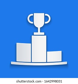 Paper cut Hockey over sports winner podium icon isolated on blue background. Paper art style. Vector Illustration