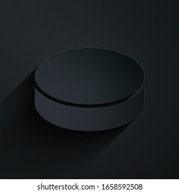 Paper cut Hockey puck icon isolated on black background. Paper art style. Vector Illustration
