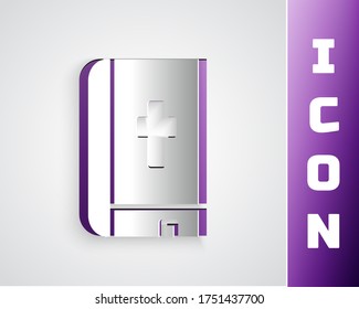 Paper cut Holy bible book icon isolated on grey background. Paper art style. Vector