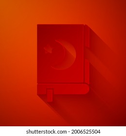 Paper cut Holy book of Koran icon isolated on red background. Muslim holiday, Eid Mubarak, Eid al-fitr, Ramadan Kareem. Paper art style. Vector Illustration