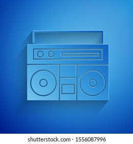 Paper cut Home stereo with two speakers icon isolated on blue background. Music system. Paper art style. Vector Illustration