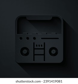 Paper cut Home stereo with two speakers icon isolated on black background. Music system. Paper art style. Vector