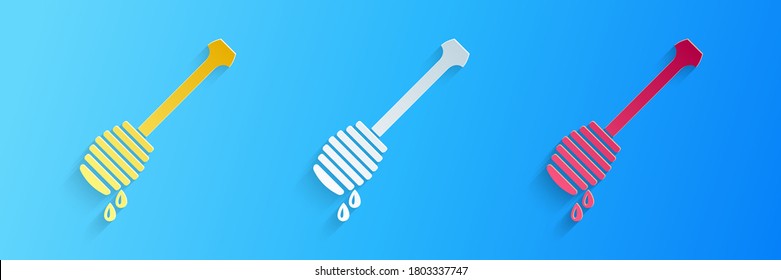 Paper cut Honey dipper stick with dripping honey icon isolated on blue background. Honey ladle. Paper art style. Vector.