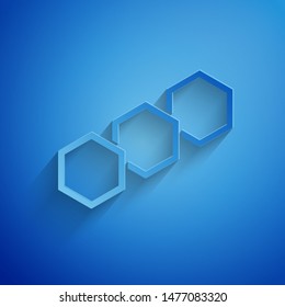Paper cut Honeycomb icon isolated on blue background. Honey cells symbol. Sweet natural food. Paper art style. Vector Illustration