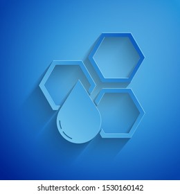 Paper cut Honeycomb icon isolated on blue background. Honey cells symbol. Sweet natural food. Paper art style. Vector Illustration