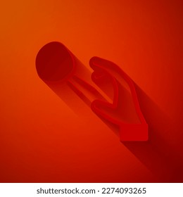 Paper cut Hooligan shooting small stones icon isolated on red background. Demonstrator. Paper art style. Vector