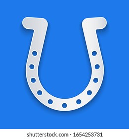 Paper cut Horseshoe icon isolated on blue background. Paper art style. Vector Illustration