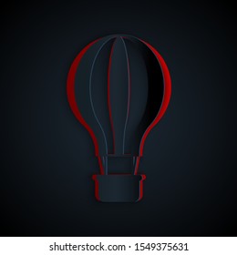 Paper cut Hot air balloon icon isolated on black background. Air transport for travel. Paper art style. Vector Illustration
