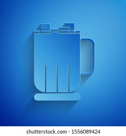 Paper cut Hot chocolate cup with marshmallows icon isolated on blue background. Merry Christmas and Happy New Year. Paper art style. Vector Illustration