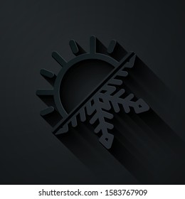 Paper cut Hot and cold symbol. Sun and snowflake icon isolated on black background. Winter and summer symbol. Paper art style. Vector Illustration