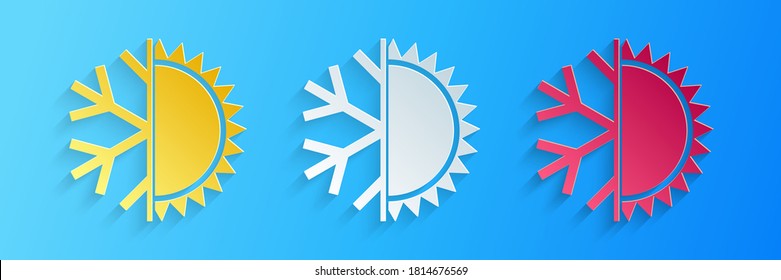 Cortado de papel Símbolo caliente y frío. Icono de sol y copo de nieve aislado en fondo azul. Símbolo de invierno y verano. Estilo de arte de papel. Vector.