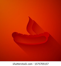 Paper cut Hotdog sandwich with mustard icon isolated on red background. Sausage icon. Fast food sign. Paper art style. Vector Illustration