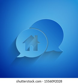 Paper cut House building in speech bubble icon isolated on blue background. Real estate concept. Paper art style. Vector Illustration