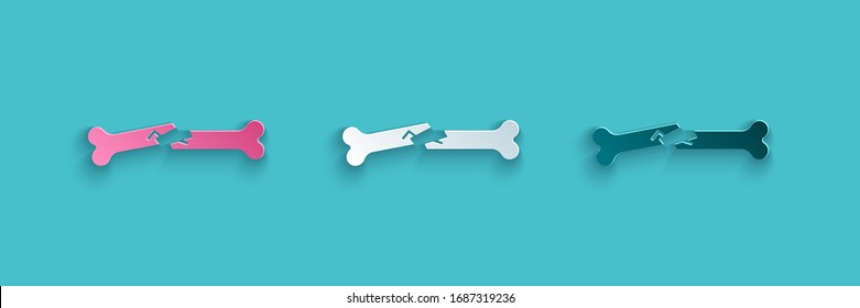 Paper cut Human broken bone icon isolated on blue background. Paper art style. Vector Illustration