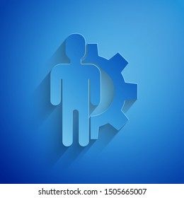 Paper cut Human with gear inside icon isolated on blue background. Artificial intelligence. Thinking brain sign. Symbol work of brain. Paper art style. Vector Illustration