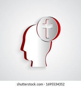 Paper cut Human head with christian cross icon isolated on grey background. Paper art style. Vector Illustration