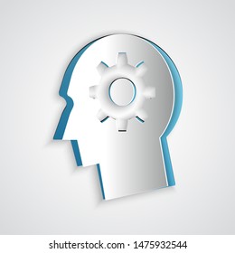 Paper cut Human head with gear inside icon isolated on grey background. Artificial intelligence. Thinking brain sign. Symbol work of brain. Paper art style. Vector Illustration