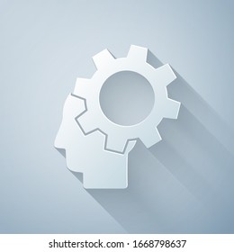Paper cut Human head with gear inside icon isolated on grey background. Artificial intelligence. Thinking brain. Symbol work of brain. Paper art style. Vector Illustration