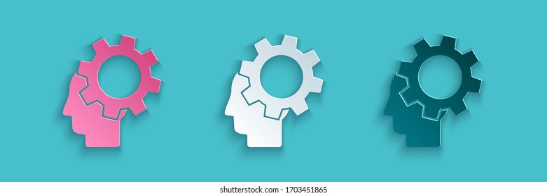 Paper cut Human head with gear inside icon isolated on blue background. Artificial intelligence. Thinking brain. Symbol work of brain. Paper art style. Vector Illustration
