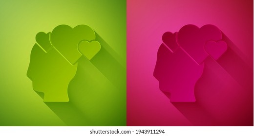 Paper cut Human head with heart icon isolated on green and pink background. Love concept with human head. Paper art style. Vector