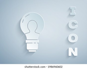 Paper cut Human head with lamp bulb icon isolated on grey background. Paper art style. Vector