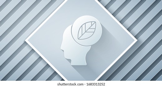 Paper cut Human head with leaf inside icon isolated on grey background. Paper art style. Vector Illustration