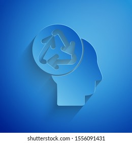 Paper cut Human head with recycle icon isolated on blue background. Recycling thinking. Ecology friendly. Paper art style. Vector Illustration