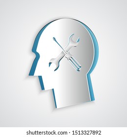 Paper cut Human head with with screwdriver and wrench icon isolated on grey background. Artificial intelligence. Symbol work of brain. Paper art style. Vector Illustration