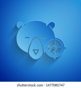 Paper cut Hunt on bear with crosshairs icon isolated on blue background. Hunting club logo with bear and target. Rifle lens aiming a bear. Paper art style. Vector Illustration