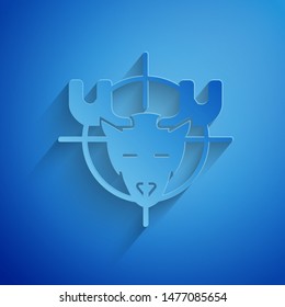 Paper cut Hunt on moose with crosshairs icon isolated on blue background. Hunting club logo with moose and target. Rifle lens aiming a moose. Paper art style. Vector Illustration