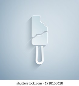 Paper cut Ice cream on stick icon isolated on grey background. Sweet symbol. Paper art style. Vector.