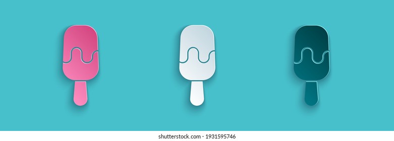 Paper cut Ice cream on stick icon isolated on blue background. Sweet symbol. Paper art style. Vector