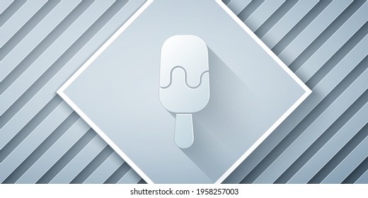 Paper cut Ice cream on stick icon isolated on grey background. Sweet symbol. Paper art style. Vector