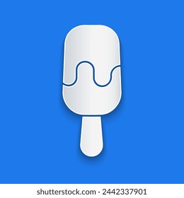 Paper cut Ice cream on stick icon isolated on blue background. Sweet symbol. Paper art style. Vector