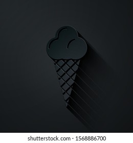 Paper cut Ice cream in waffle cone icon isolated on black background. Sweet symbol. Paper art style. Vector Illustration
