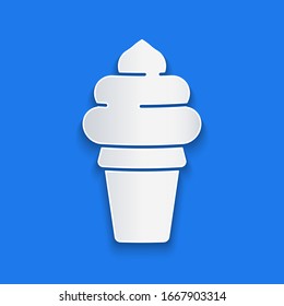 Paper cut Ice cream in waffle cone icon isolated on blue background. Sweet symbol. Paper art style. Vector Illustration