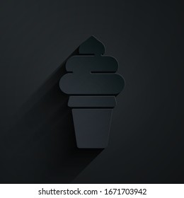 Paper cut Ice cream in waffle cone icon isolated on black background. Sweet symbol. Paper art style. Vector Illustration