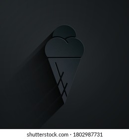 Paper cut Ice cream in waffle cone icon isolated on black background. Sweet symbol. Paper art style. Vector Illustration