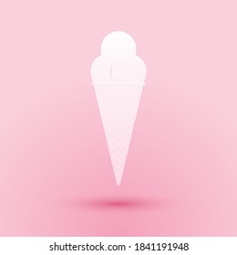 Paper cut Ice cream in waffle cone icon isolated on pink background. Paper art style. Vector.