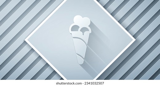 Paper cut Ice cream in waffle cone icon isolated on grey background. Sweet symbol. Paper art style. Vector